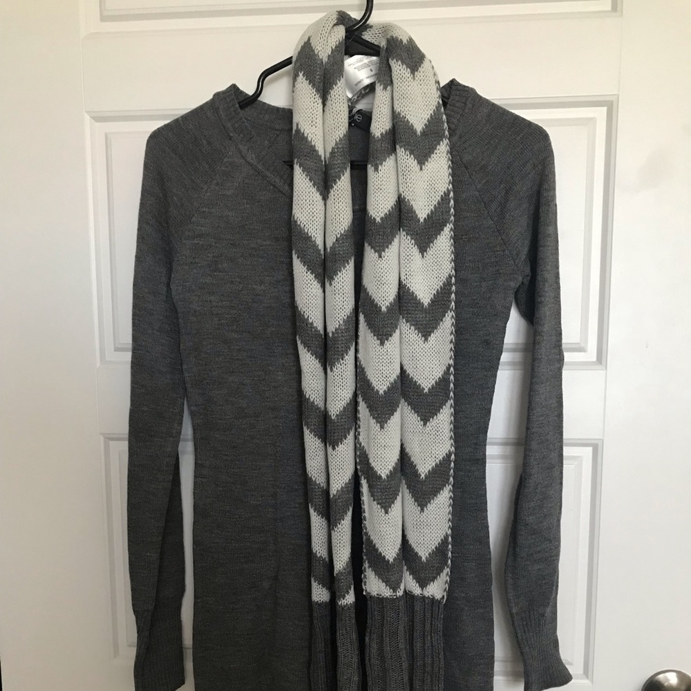 Gray long sleeved dress with white and gray scarf